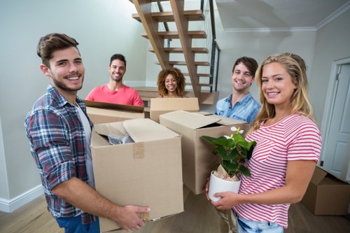 Customers preparing for a local move with a hired removal truck