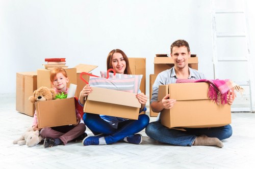 Careful loading of household items into a van for transport