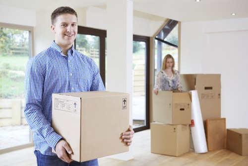 Wrapped furniture being handled carefully during a removals job