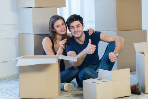 Local commercial movers preparing office equipment for transport
